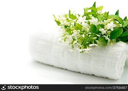 Tropical white and fragrant flower, Wild Water Plum (Wrightia religiosa) with towel on spa theme