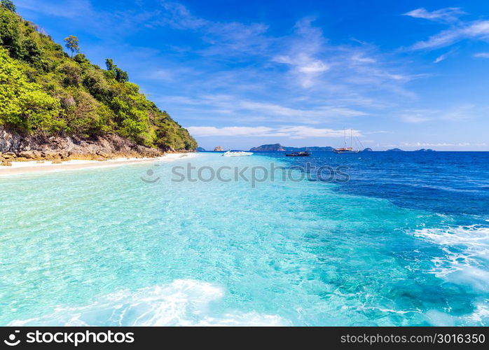 Tropical white sand beach at snoekel point from speed boat at andaman sea indian ocean Myanmar and Thailand.