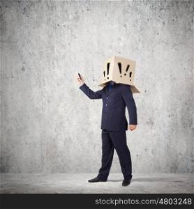 Trouble in business. Troubled businessman with carton box on head expressing emotions