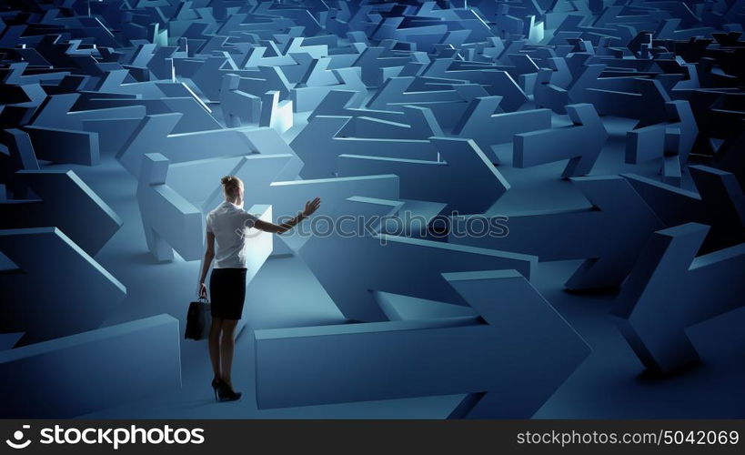 Troubled businesswoman finding way out. Puzzled businesswoman in labyrinth choosing her way direction