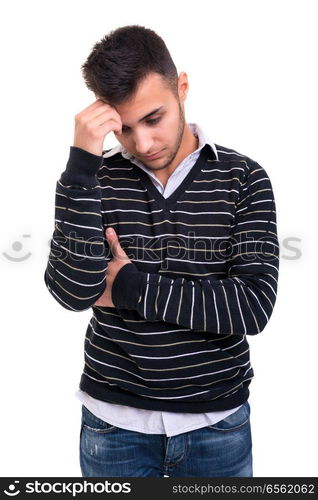 Troubled young man posing isolated over white background