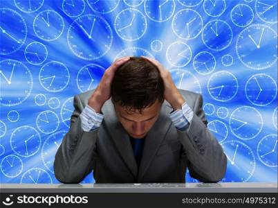 Troubles in business. Depressed tired businessman with hands on head