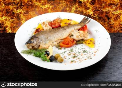 trout fish baked with pepper, string beans, tomato and cauliflower