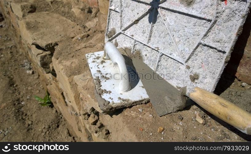 trowels and other masonry tools.