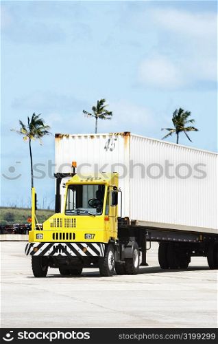 Truck driver driving a semi-truck, Nawiliwili Beach Park, Kauai, Hawaii Islands, USA