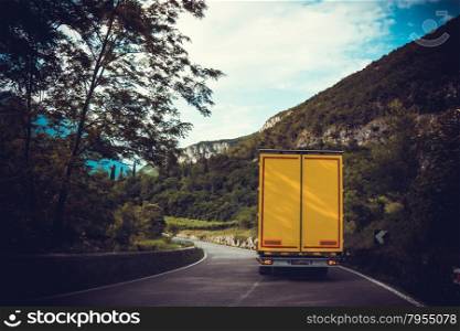truck on road. cargo transportation. Yellow truck