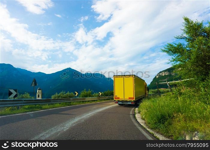 truck on road. cargo transportation. Yellow truck