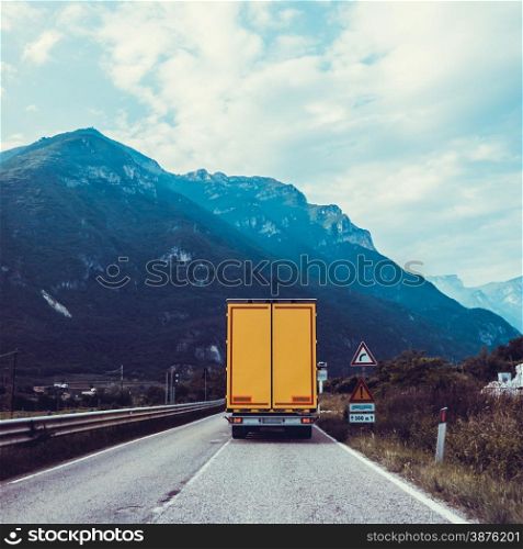 truck on the road. Yellow cargo car