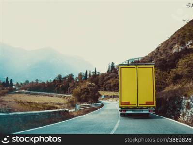 truck on the road. Yellow cargo car