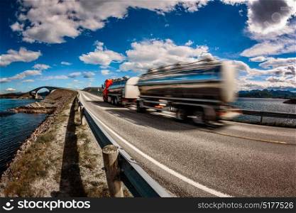 Truck rushes down the highway in the background Atlantic Ocean Road Norway. Truck Car in motion blur.