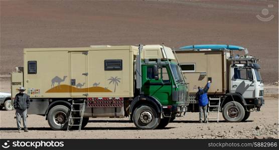 Trucks in a desert, Los Flamencos National Reserve, San Pedro de Atacama, El Loa Province, Antofagasta Region, Chile-Bolivia Border