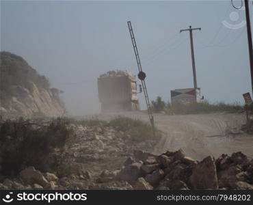 Trucks on dusty road in Southern Turkey