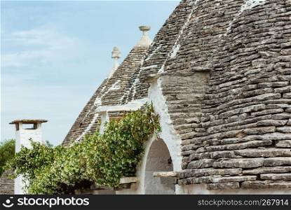 Trulli houses roofs in main touristic district of Alberobello beautiful old historic town, Apulia region, Southern Italy.
