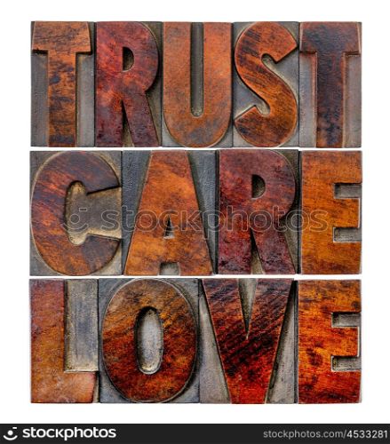 trust, care, love - an isolated word abstract in vintage letterpress wood type