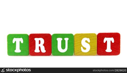 trust - isolated text in wooden building blocks
