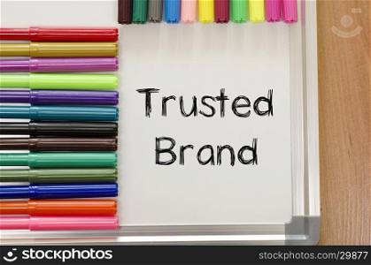 Trusted brand text concept over whiteboard background