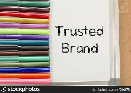 Trusted brand text concept over whiteboard background