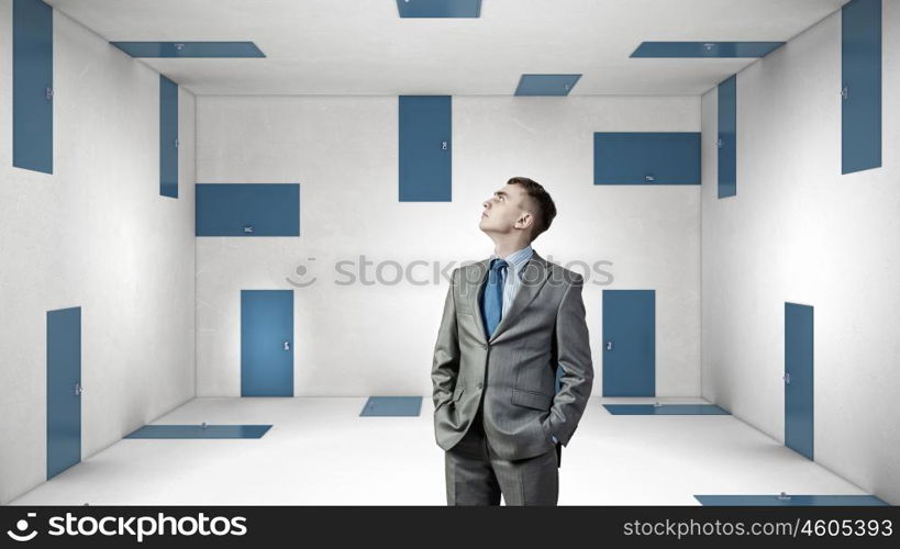 Trying to find way out. Mixed media. Businessman in room choosing one of plenty of doors