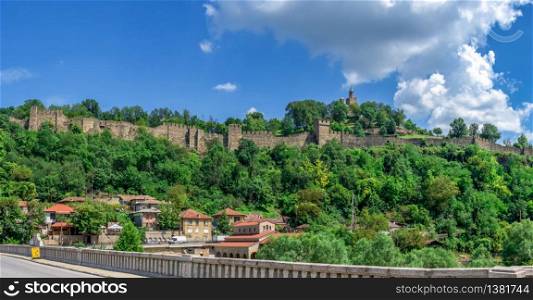 Tsarevets fortress with the Patriarchal Cathedral of the Holy Ascension of God in Veliko Tarnovo, Bulgaria. Big size panoramic view on a sunny summer day. Tsarevets fortress in Veliko Tarnovo, Bulgaria