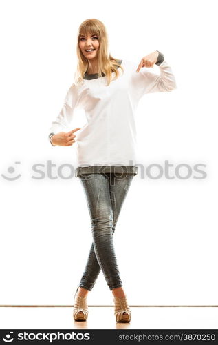 Tshirt design concept. Full length blonde fashion woman jeans pants white blank long-sleeved shirt pointing at herself isolated