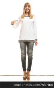 Tshirt design concept. Full length blonde fashion woman jeans pants white blank long-sleeved shirt pointing at herself isolated