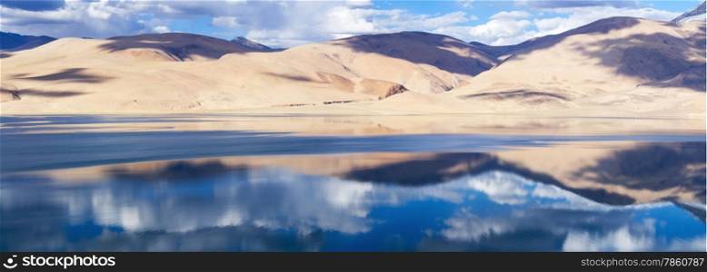 Tso Moriri mountain lake panorama with mountains and blue sky reflections in the lake (Ladakh, north India)