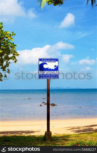 tsunami evacuation route sign on a beach, Thailand