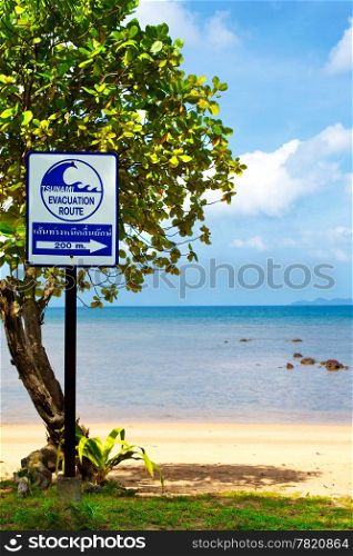 tsunami evacuation route sign on a beach, Thailand
