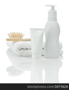 tube bottle towel and hairbrush