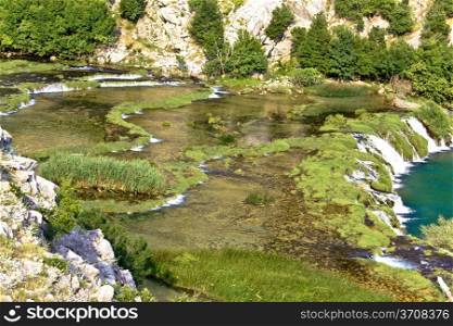 Tufa cascades of Krupa river- amazing green landscape in Croatia