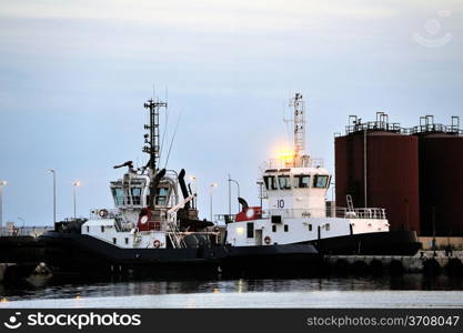 Tug boats with quay for the evening in a creek of Fos on Sea beside Marseille.