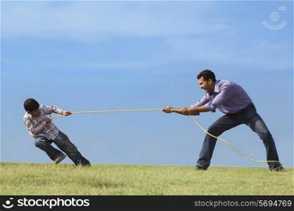 Tug of war between son and father