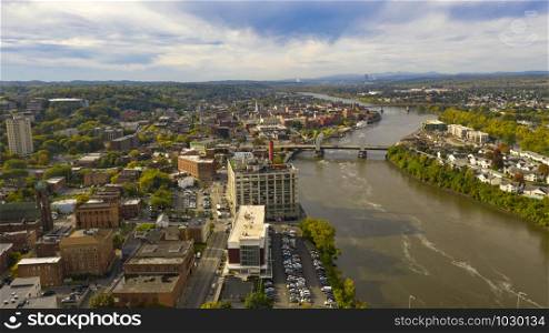 Tugboat and Downtown Troy NY in Rensselaer County along the banks of the Hudson River
