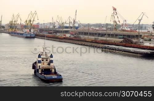 tugboat floats in the port