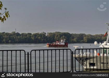 Tugboat pass along the Ruse port at Danube river, Bulgaria