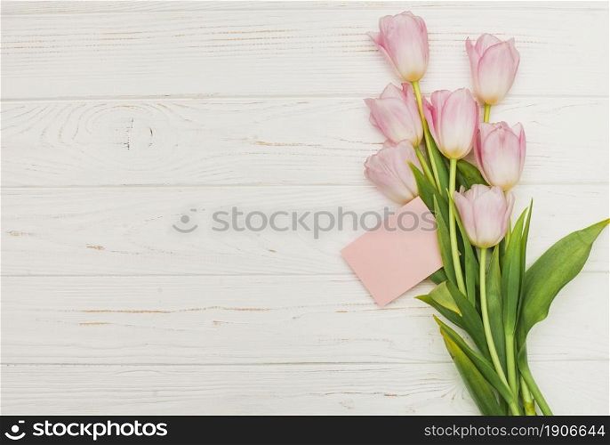 tulip bouquet with empty card wooden table. High resolution photo. tulip bouquet with empty card wooden table. High quality photo