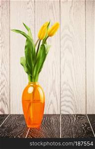 tulip flowers bouquet in vase on wooden background. Tulip Flowers Bouquet In Vase