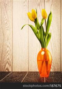 tulip flowers bouquet in vase on wooden background. Tulip Flowers Bouquet In Vase
