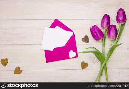 tulip flowers with blank paper envelope