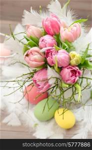 tulip flowers with easter eggs decoration. selective focus