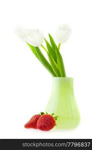 tulips in a vase and strawberries isolated on white