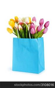 Tulips in shopping bag isolated on white
