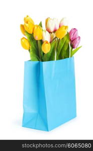 Tulips in shopping bag isolated on white