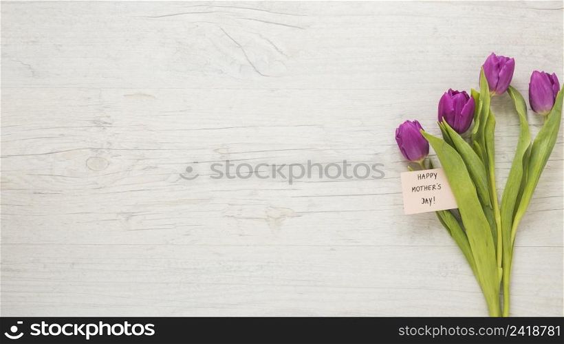 tulips with happy mothers day inscription table