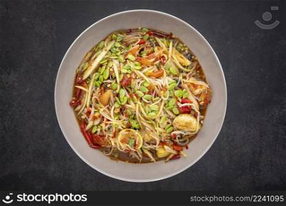 Tum Pa, Som Tum, Thai food, spicy papaya salad with Thai rice noodle, golden apple snail  Pomacea canaliculataLamarck , Leucaena leucocephala seed  Lamk seed , lime, tomato, pickled fish and chilli