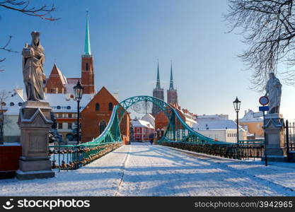 Tumski bridge over the river Odra to the island in winter.. Wroclaw. Tumski bridge.