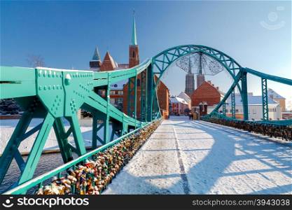 Tumski bridge over the river Odra to the island in winter.. Wroclaw. Tumski bridge.