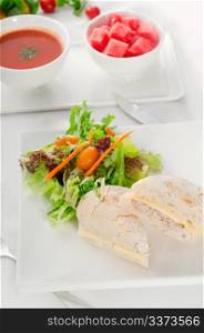 tuna fish and cheese sandwich with fresh mixed salad ,watermelon and gazpacho soup on side,with fresh vegetables on background ,MORE DELICIOUS FOOD ON PORTFOLIO