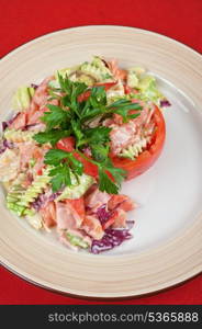 Tuna salad with different vegetables on plate