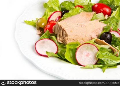 Tuna salad with tomatoes, olives and raddish